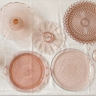 Variety of pink glass platters and cake stands