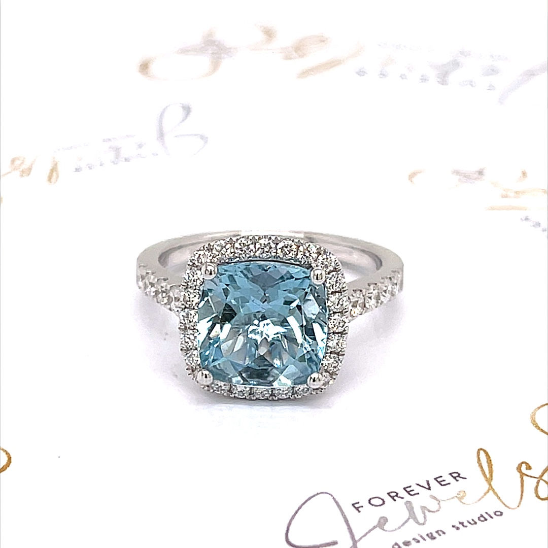 Aquamarine and Diamond Halo Ring