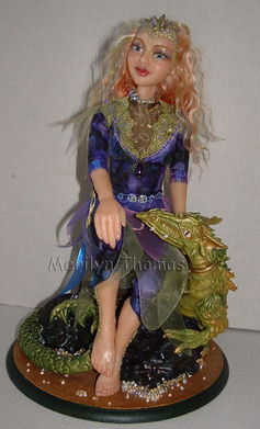 An original sculpture in clay of Sarina and her Dragon by Merilyn Thomas