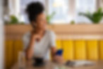 happy-woman-in-cafe-talking-on-the-phone-with-earp-2022-02-15-23-33-52-utc.jpg