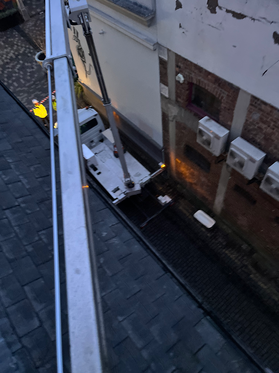 Eye-level view of a van-mounted MEWP parked on a narrow Edinburgh street