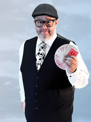 Ed Garcia holding a fan of playing cards.