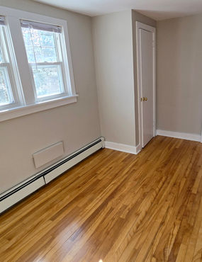 Top-floor apartment for rent in a century-old Halifax West End farmhouse with natural light, hardwood floors, and parking