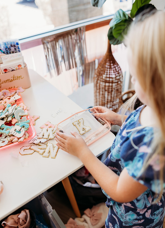 Girl designing a makeup bag at a party