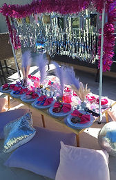 Swiftie pop star themed picnic table with all the fringe, disco, pink, and nods to the pop star's albums