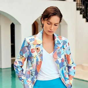 Lady by the pool in patterned jacket