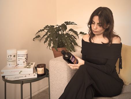 Naturopath Lia Nicolaou dispensing herbs and supplements