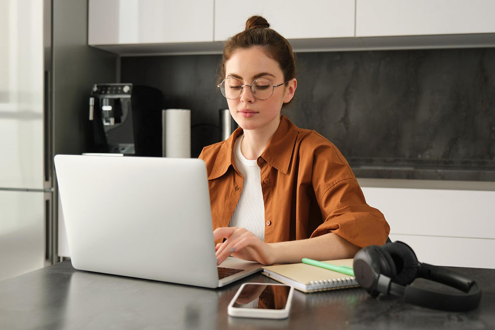 Student studying on a laptop while learning supply chain management concepts in an online bachelor’s degree program.