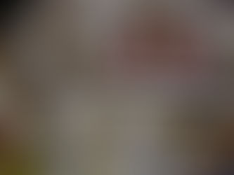 Close-up of personalized playing cards with custom back design on a wooden table.