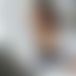 A college student attending an online business administration degree program on a laptop in a home workspace.