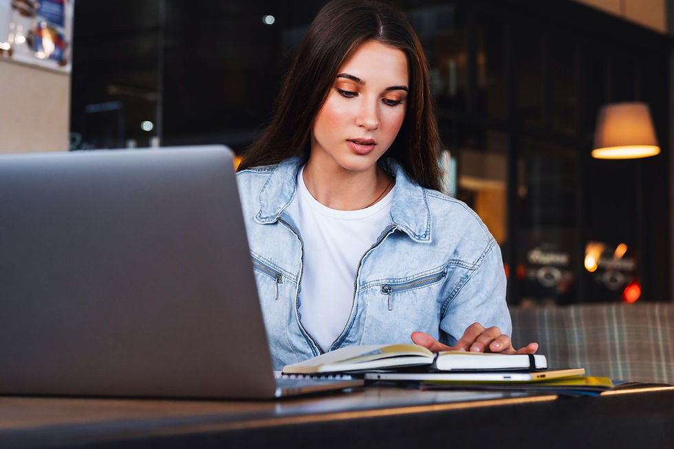 Student studying online for a bachelor’s degree in public health while reviewing health data and coursework on a laptop.