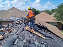 Emergency storm damage roof repair on a Florida commercial property with roofing contractors inspecting wind and hail damage after a severe storm.
