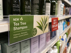Custom shelf signage on retail shelves highlighting promotions and product features to increase visibility and drive in-store sales.