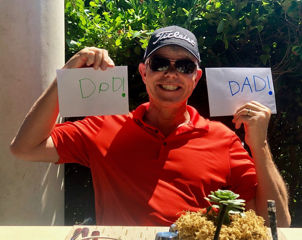Father's Day Brunch, dad holding his cards at Jasmine Porch in The Sanctuary Hotel