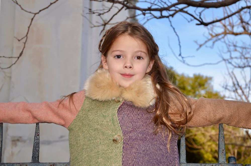 girl at iron gates of Washington Square in Charleston, South Carolina