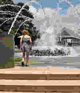cooling off in the fountain at Waterfront Park downtown Charleston, South Carolina