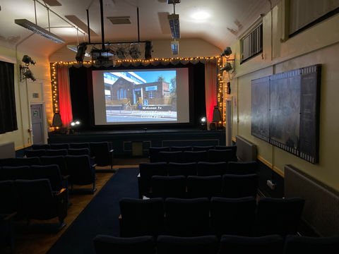Lucem House Community Cinema auditorium and stage.