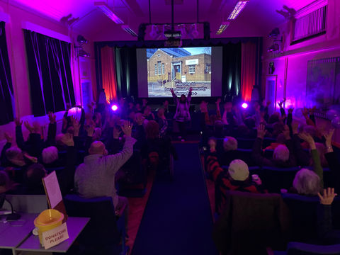 Audience saying welcome to Lucem House Community Cinema