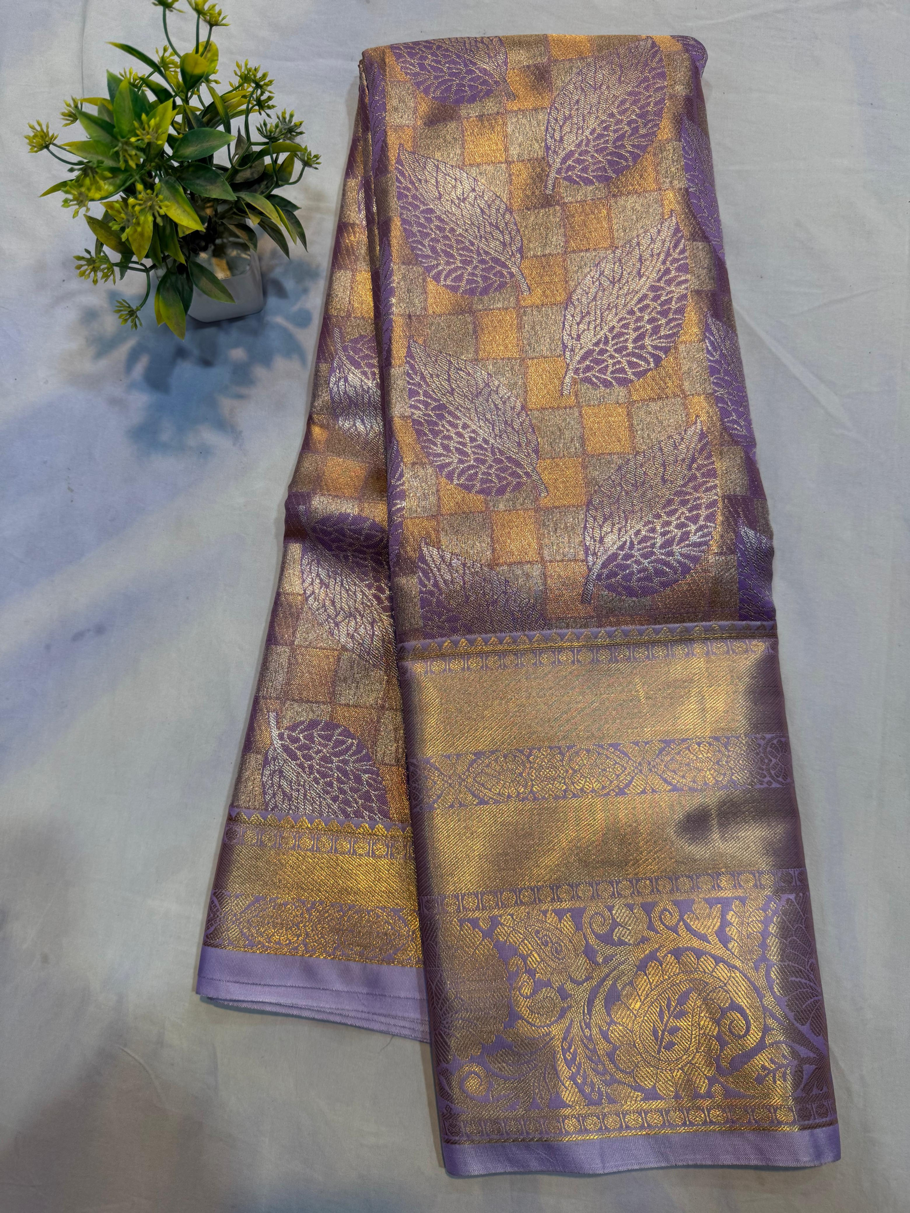 Lavender pure silk Kanjivaram saree with golden checks and silver feather design