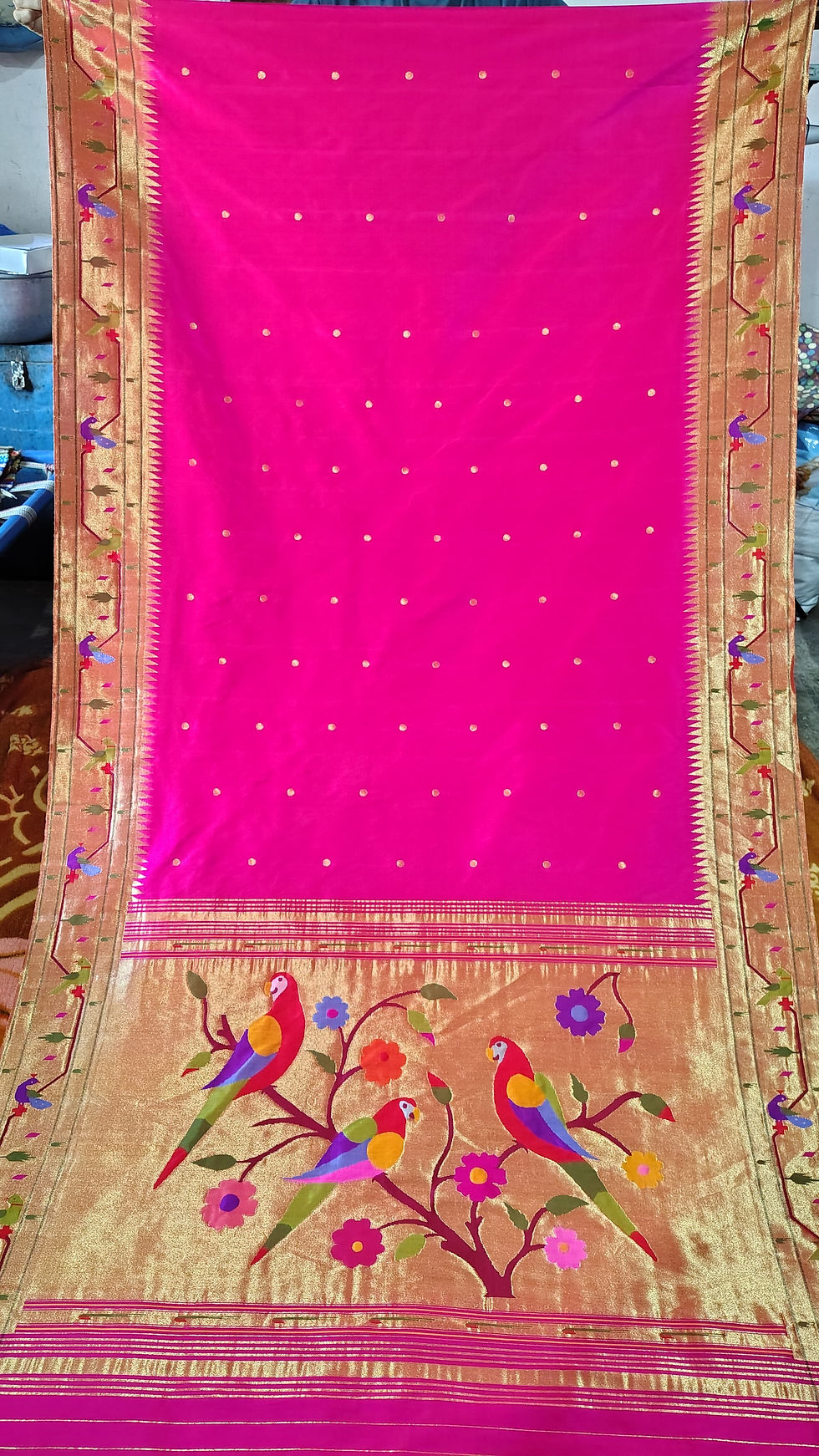 Magenta pink Paithani silk saree featuring intricate zari border