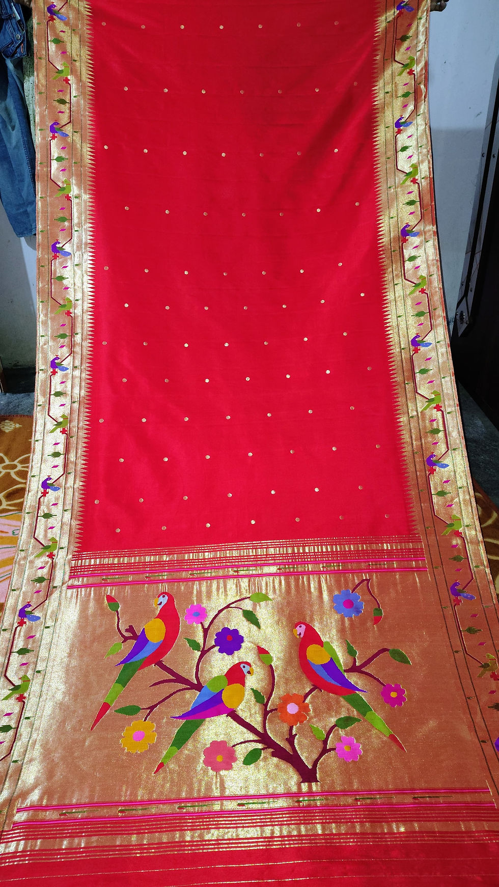 Deep red pure silk Paithani saree with heritage golden zari weaving, handwoven for bridal elegance and festive occasions