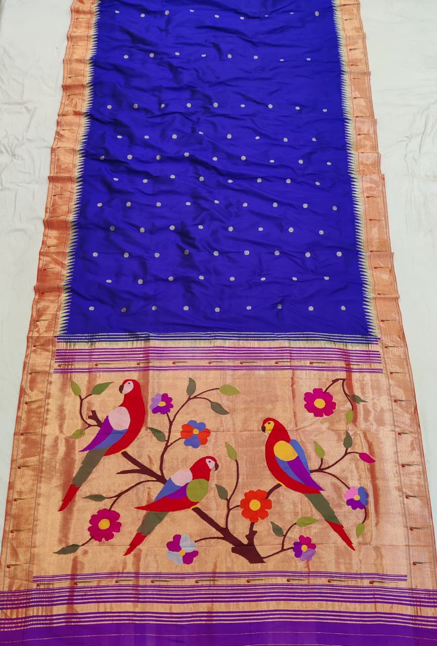 Elegant deep blue Paithani silk saree featuring intricate zari border