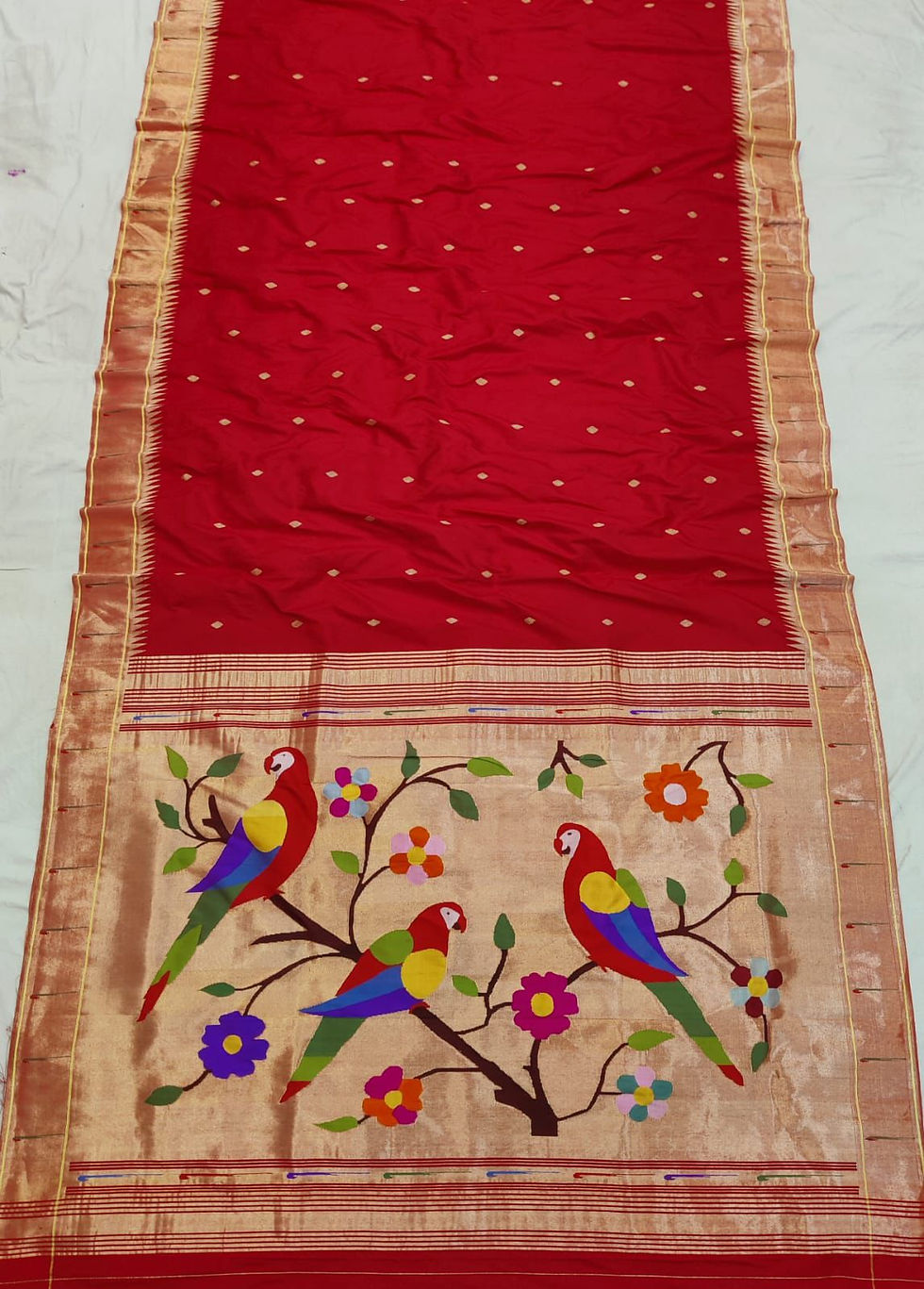 Thumbnail: Deep red pure silk Paithani saree with rich golden zari motifs, handwoven for weddings and grand festive occasions.