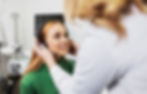 Close-up of a patient undergoing a hearing test in a modern audiology clinic, emphasizing the importance of regular hearing assessments for better hearing health.
