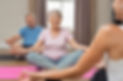 Senior couple with trainer sitting in lo