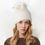 Thumbnail: Knit Beanie With  Raccoon Fur Pom Pom in Ivory