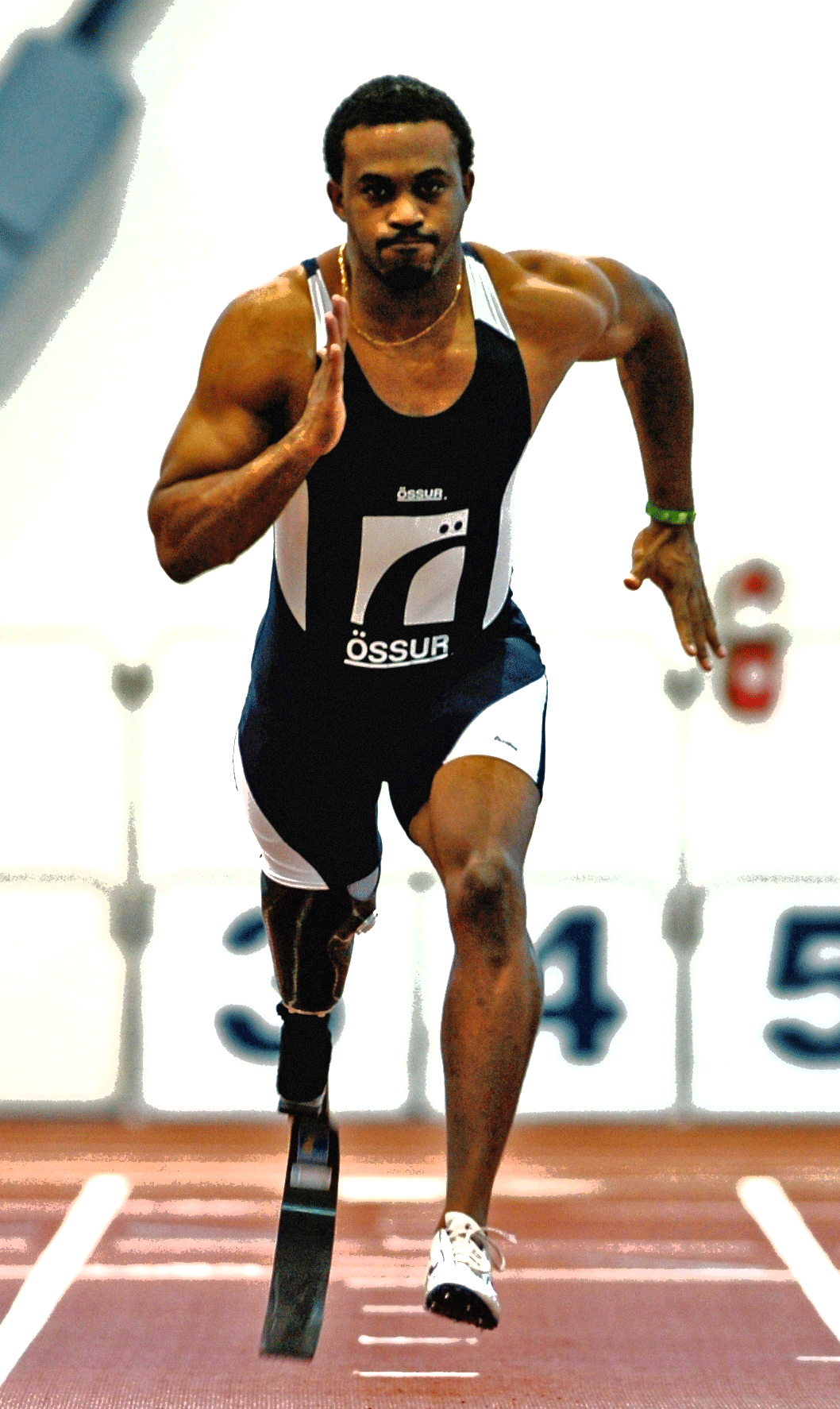 A photo of segs4vets recipient Courtney Clemmons who is sprinting down a track with a prostetic right leg.