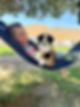 young girl in hammock with her High West Aussie" Puppy