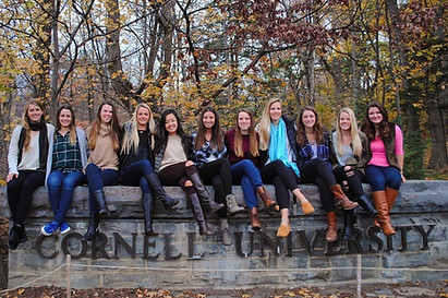 DG's sitting on CU sign on campus.jpg