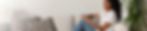 woman in a living room with REX wide image.jpg