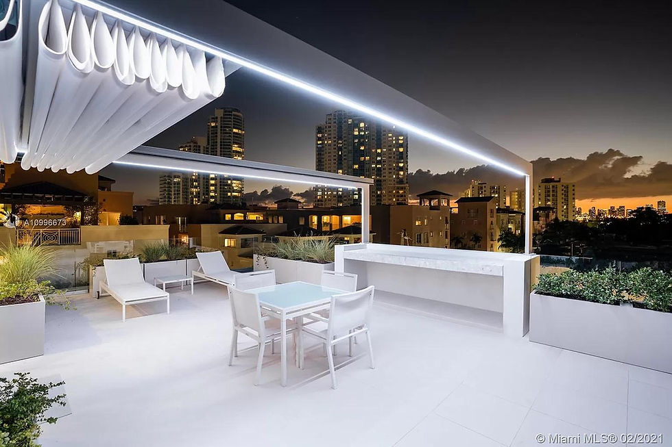 Retractable fabric pergola creating a shaded outdoor seating area on a Florida patio