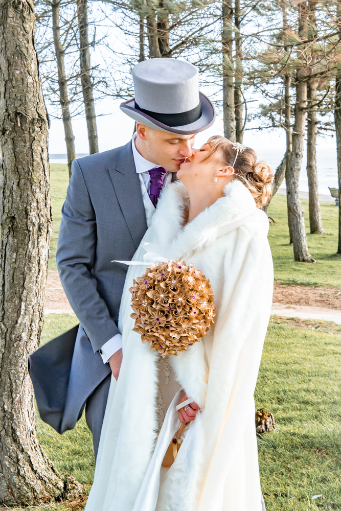 Swansea Bay wedding couple kiss