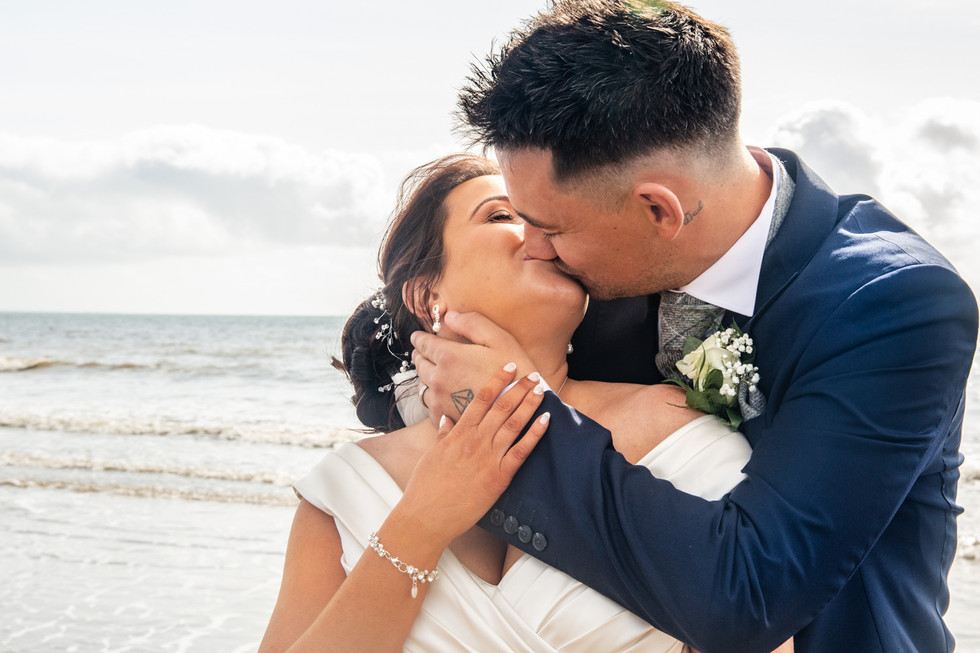 best wedding photography kiss of bride and groom in swansea and gower beach