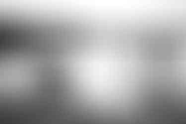 children chase their dog on the low tide beach at oxwich