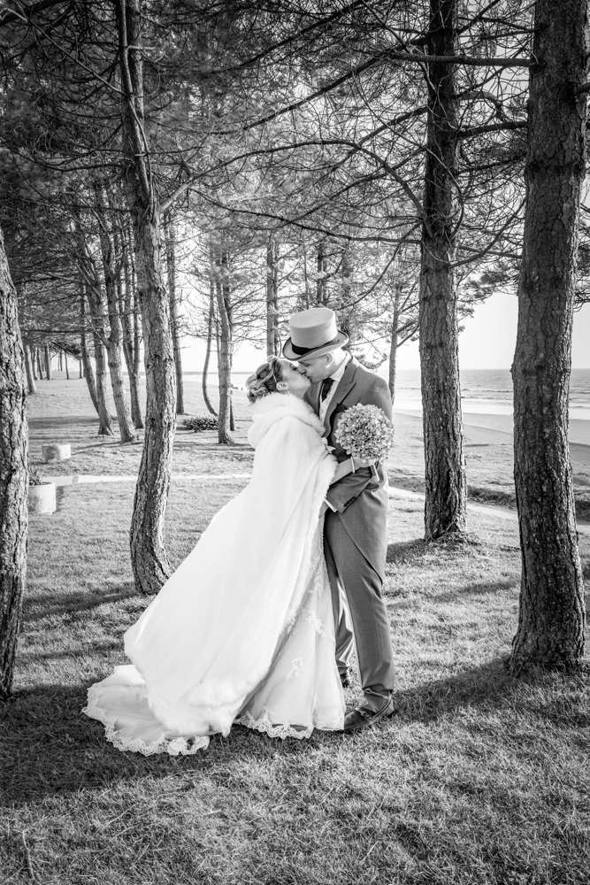 bride and groom pose for a Swansea and Gower wedding photographer