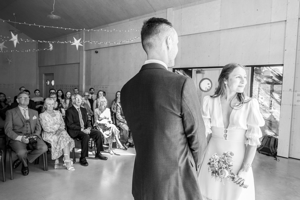 guests look at couple getting married at ogmore on sea