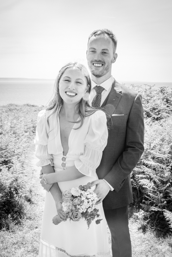 bride and groom have photography session at ogmore by sea for their wedding photos