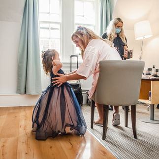 Bride looks at her daughter excitedly ready for the wedding 