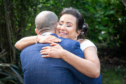bride embraces wedding guest in swansea bay