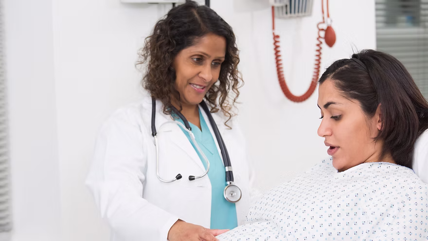 Doctor examining pregnant patient