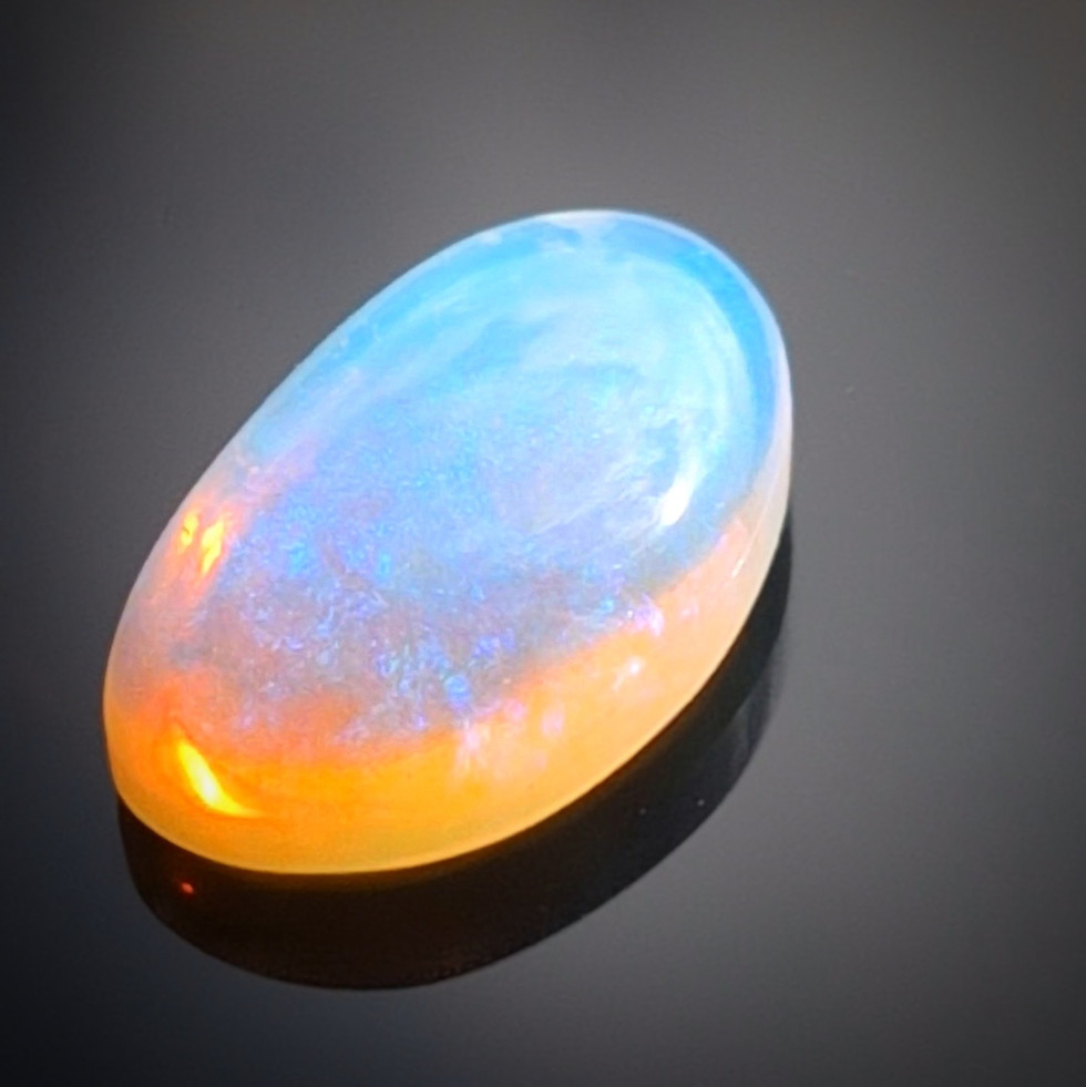 Rare 2.30ct Lightning Ridge jelly opal (12.3x7.45mm). Lose Australian gem with mesmerizing blue hues.