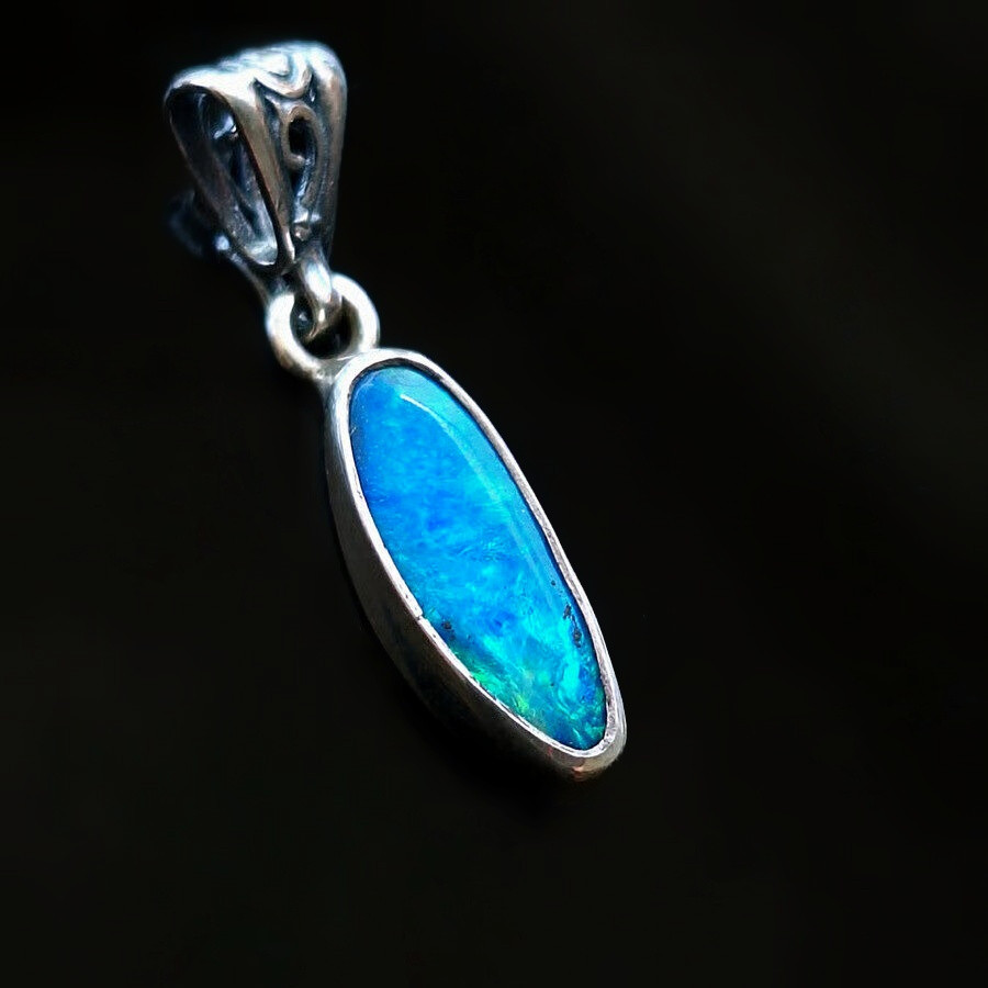 925 sterling bezel pendant lightning ridge doublet opal with electric blue and ocean green flash right hand view