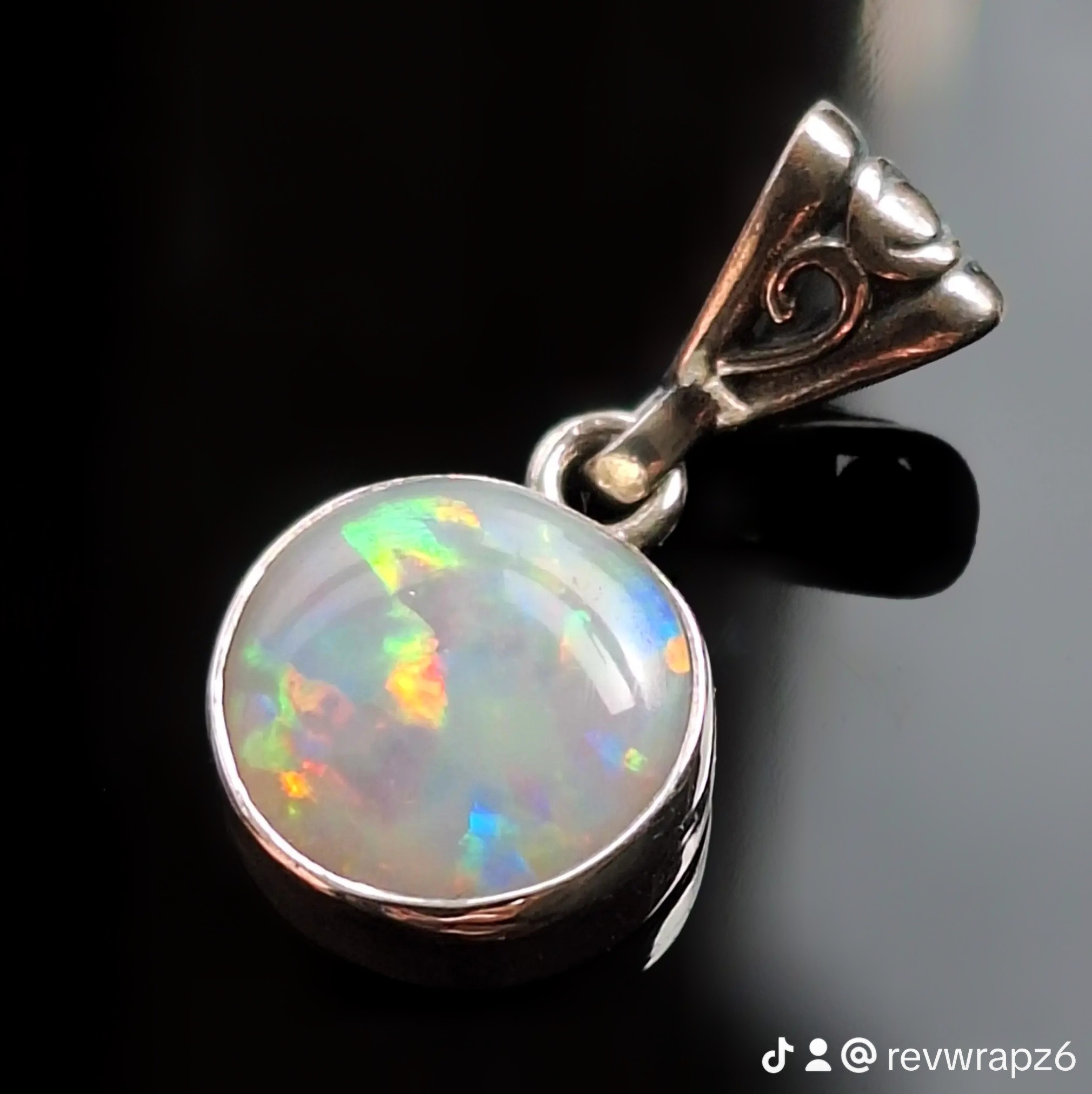 Coober Pedy CP Olympic solid opal pendant with bright multicolour fire. front left view