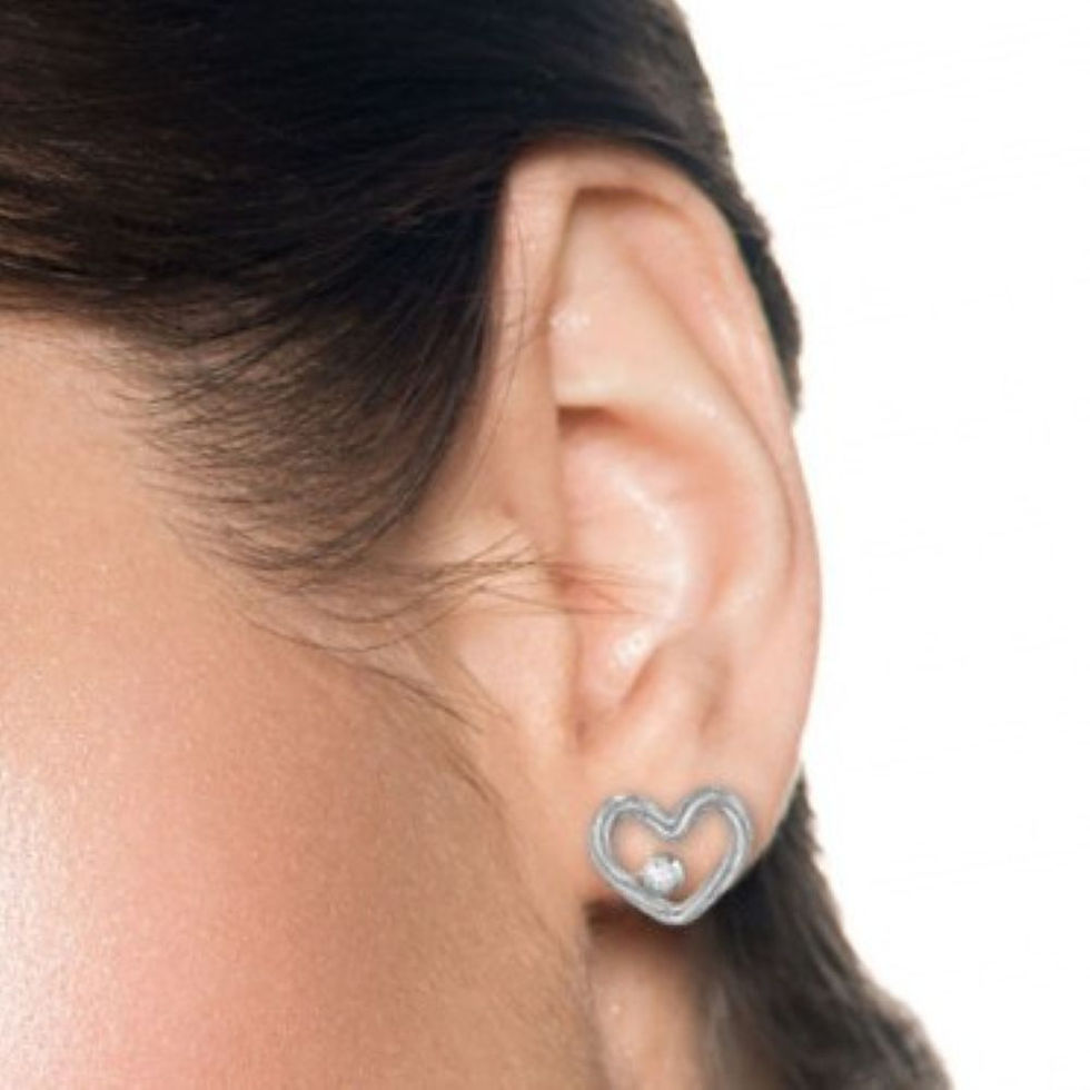 Sterling silver natural diamond open-heart ear stud worn on the earlobe