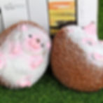 Two adorable hedgehog figurines on green grass. LY LAND big staple