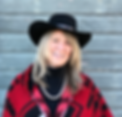 Lynn, smiling in red shawl, black hat